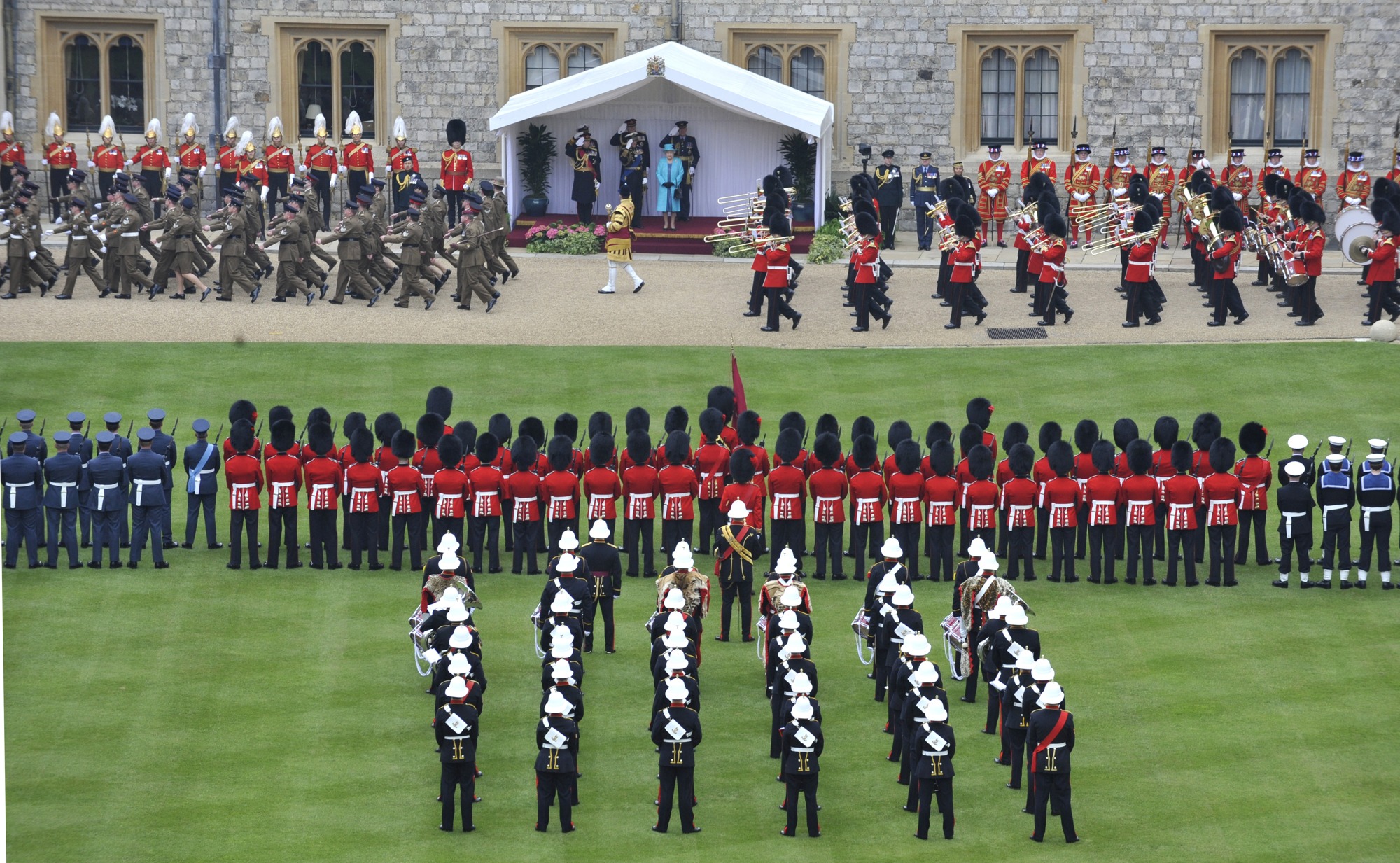 British Army soldiers and military bands pass in review during a parade at Windsor Castle.