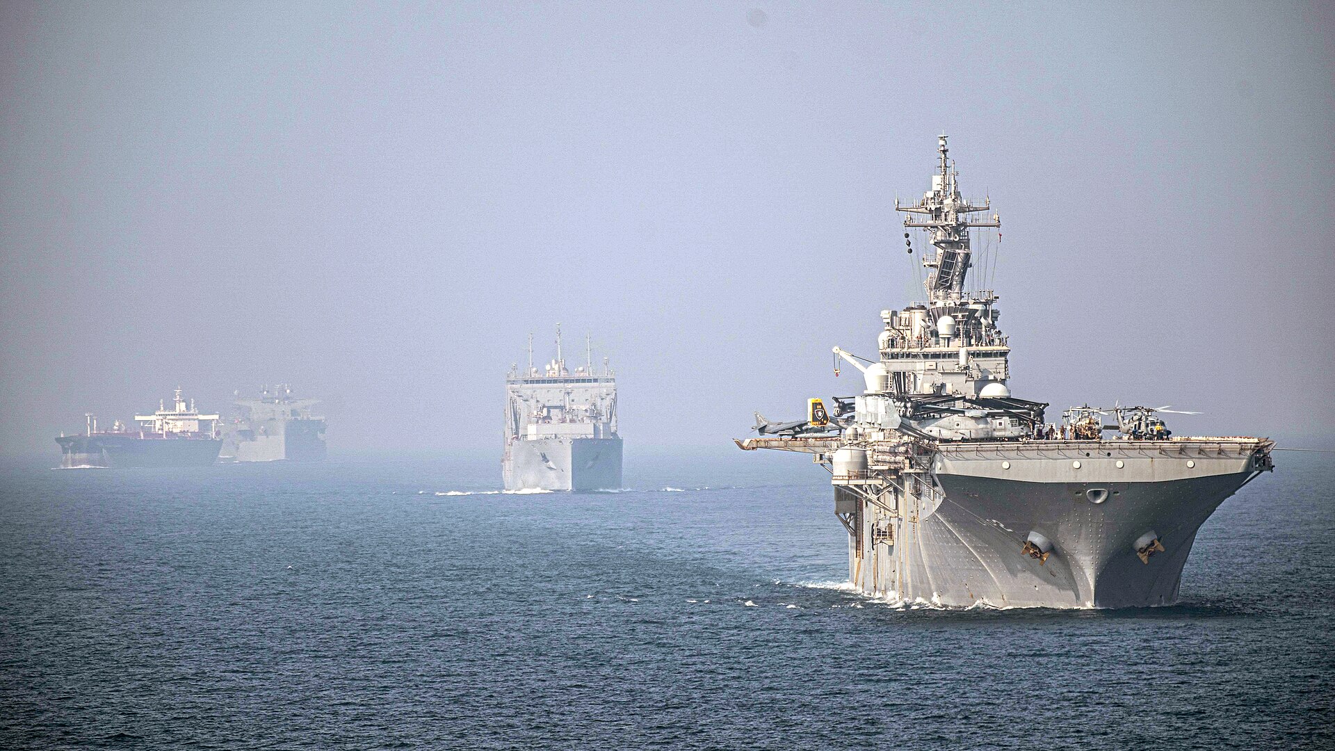 USS Essex and USNS Wally Schirra transit the Strait of Hormuz in formation in September 2021.